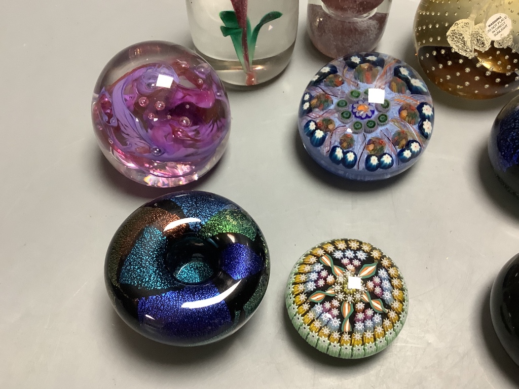 Eleven glass paperweights